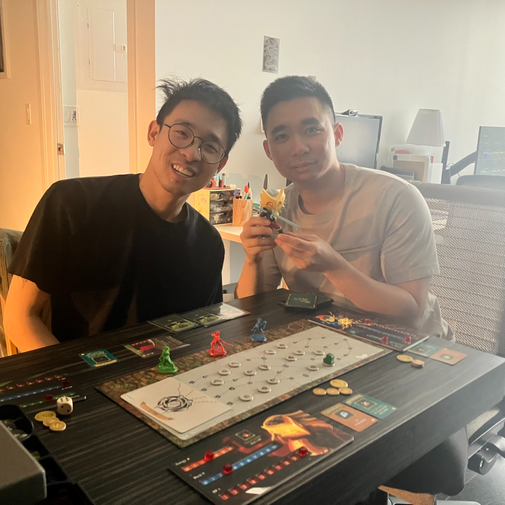 Two men playing a board game together in a casual setting.
